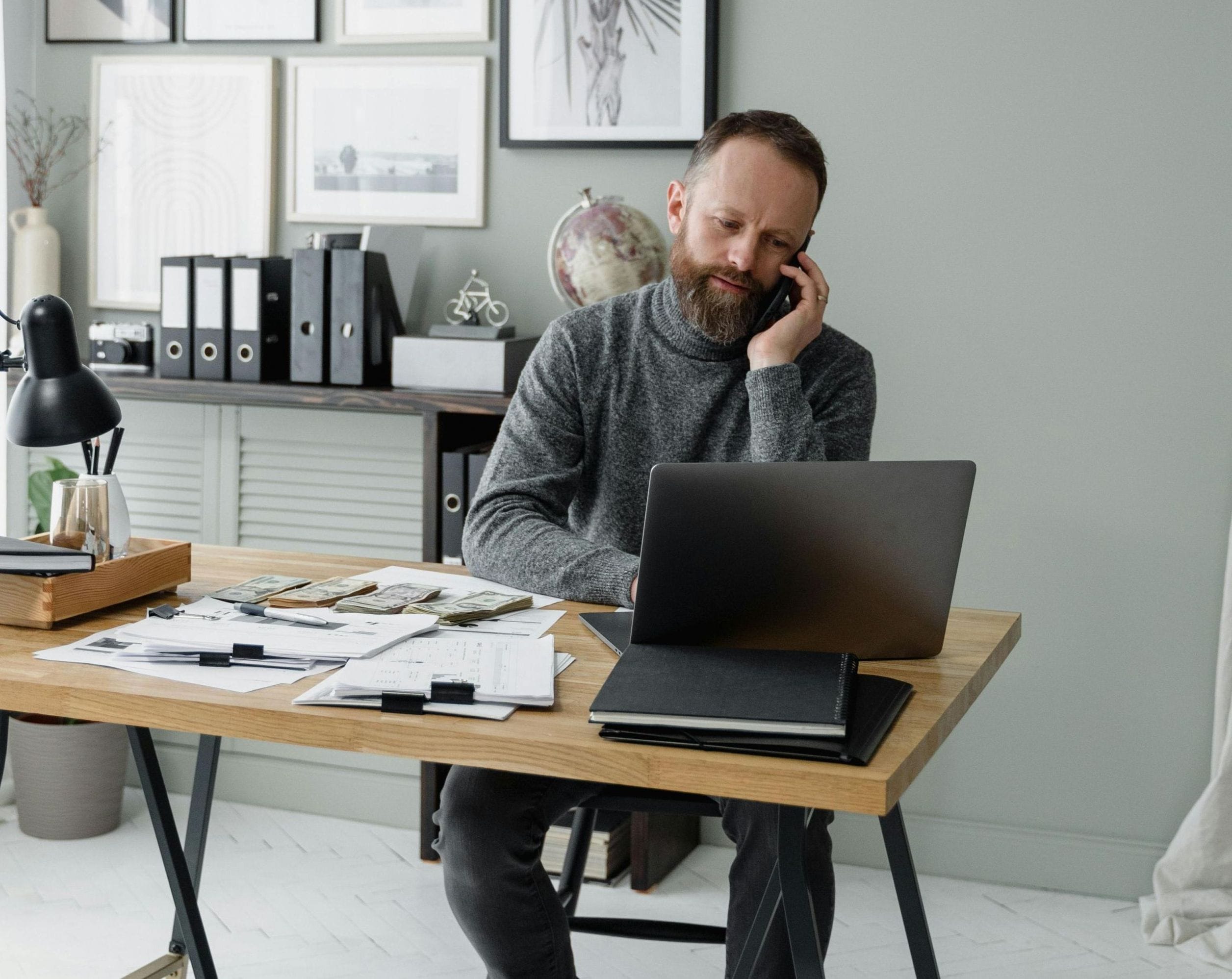 Financial advisor sitting at his desk